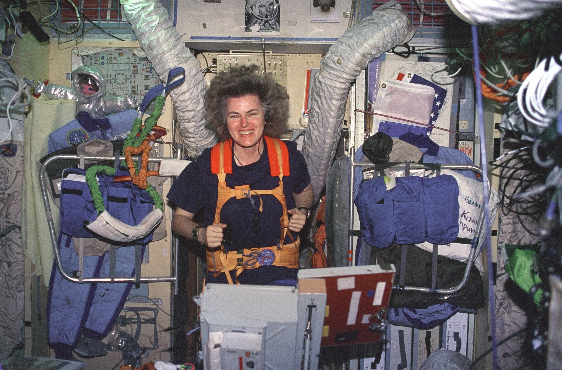 Astronaut Shannon Lucid on a treadmill inside the crowded Mir space station